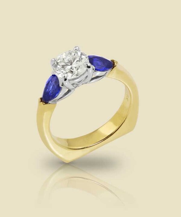 18K Yellow Gold and Platinum Ring with 90ct F Color Diamond and 60ctw Pear Shape Sapphires