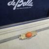 18k Gold Coral & Diamond Zia symbol brooch